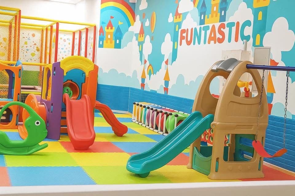 Kids swings and play equipment inside Funtastic Kids